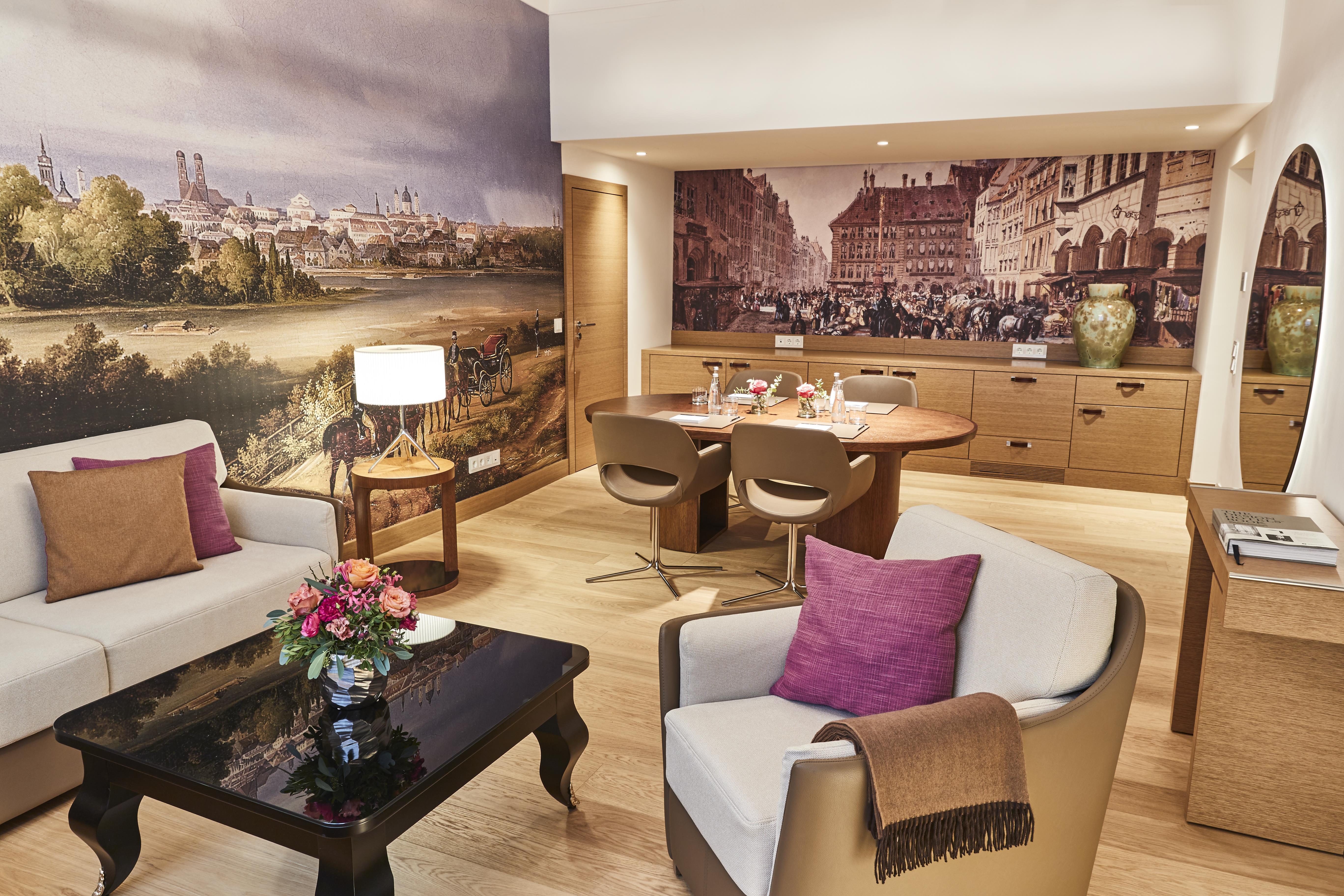 Executive Suite living and dining area with large historic Munich city murals at Hotel Vier Jahreszeiten Kempinski München